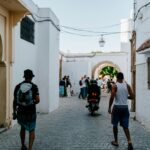 A vibrant scene capturing everyday life in the streets of Rabat, Morocco.